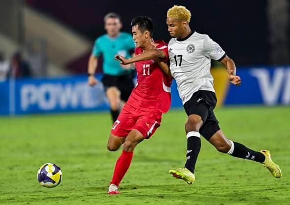 Germany v Korea DPR : Group G - FIFA U-17 World Cup Qatar 2025 Maik Afri Akumu of Germany and Kyong Bong Ri of Korea DPR in action during the FIFA U-17 World Cup Qatar 2025 Group G match between Germany and Korea DPR in Doha, Qatar, on November 7, 2025. DOHA Qatar Copyright: xNOUSHADxTHEKKAYILx