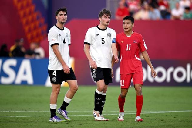 Football, Junior U 17 World Cup 2025 in Doha Qatar Preliminary round 07 11 2025 Group G Germany Korea DPR Elias Vali Fard left, Germany vs Ben Hawighorst center, Germany vs Kang Rim Ri right, Korea DPR