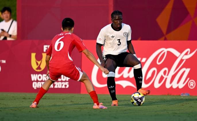 Football, Junior U 17 World Cup 2025 in Doha Qatar Preliminary round 07 11 2025 Group G Germany Korea DPR Jin Sok An left, Korea DPR against Osman Mohamed Turay right, Germany