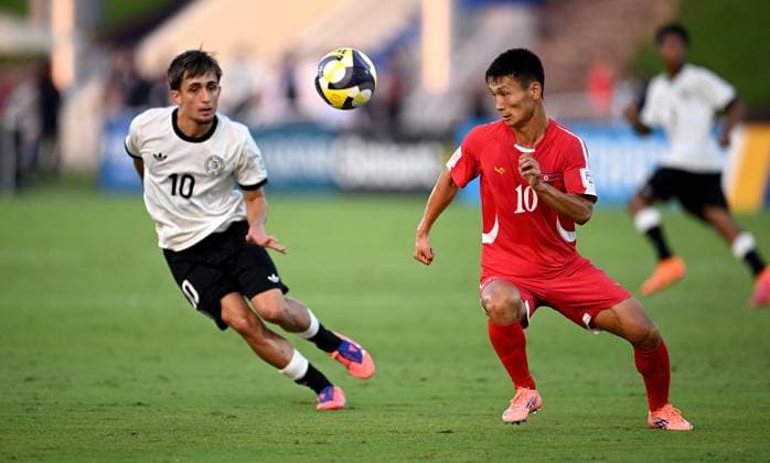 Football, Junior U 17 World Cup 2025 in Doha Qatar Preliminary round 07 11 2025 Group G Germany Korea DPR Kwang Song Pak left, Korea DPR against Yu Jin Kim right, Korea DPR