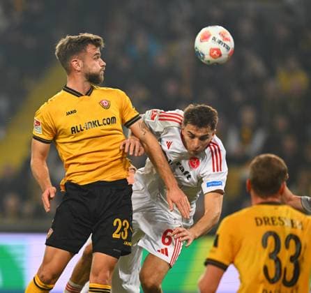 v l Lars Bünning Dresden vs Adam Markhiyev Nuremberg , 07 11 2025, Football, GER, Season 2025 2026, 2 Bundesliga, Zweite Liga, Matchday 12, Rudolf Harbig Stadion Dresden, SG Dynamo Dresden 1 FC Nürnberg, DFB AND DFL REGULATIONS PROHIBIT ANY USE OF PHOTOGRAPHS as IMAGE SEQUENCES and or QUASI VIDEO,
