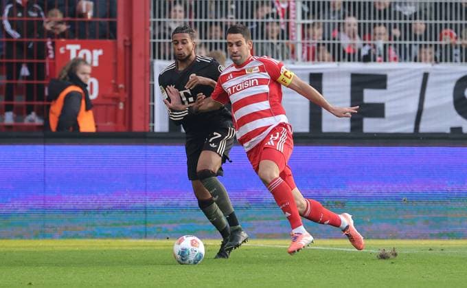 Michael Olise, Rani Khedira duel match scene Action Sport Football Soccer Bundesliga Men DFL 10 Matchday Season 2025 2026 08 11 2025 1 FC Union Berlin FCU vs FC Bayern Munich FCB DFL regulations prohibit any use of photographs as image sequences and or quasi video