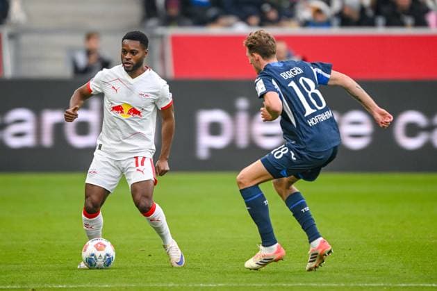 Ridle Baku (RB Leipzig) und Wouter Burger (1899 Hoffenheim) im Zweikampf waehrend des spiels der Bundesliga zwischen TSG Hoffenheim und RB Leipzig, PreZero Arena am 08. November 2025 in Sinsheim, Deutschland. (Foto von Harry Langer DeFodi Images) +++ Ridle Baku (RB Leipzig) und Wouter Burger (1899 Hoffenheim) battle for the ball during the Bundesliga match between TSG Hoffenheim and RB Leipzig at PreZero Arena on November 8, 2025 in Sinsheim, Germany. (Photo by Harry Langer DeFodi Images) DFL regulations prohibit any use of photographs as image sequences and or quasi-video. (Photo by Harry Langer DeFodi Images) DFL regulations prohibit any use of photographs as image sequences and or quasi-video. Ridle Baku RB Leipzig and Wouter Burger 1899 Hoffenheim in a duel during the Bundesliga match between TSG Hoffenheim and RB Leipzig, PreZero Arena on November 08, 2025 in Sinsheim, Germany Photo by Harry Langer DeFodi Images Ridle Baku RB Leipzig and Wouter Burger 1899 Hoffenheim battle for the ball during the Bundesliga match between TSG Hoffenheim and RB Leipzig at PreZero Arena on November 8, 2025 in Sinsheim, Germany Photo by Harry Langer DeFodi Images DFL regulations prohibit any use of photographs as image sequences and or quasi video Photo by Harry Langer DeFodi Images DFL regulations prohibit any use of photographs as image sequences and or quasi video