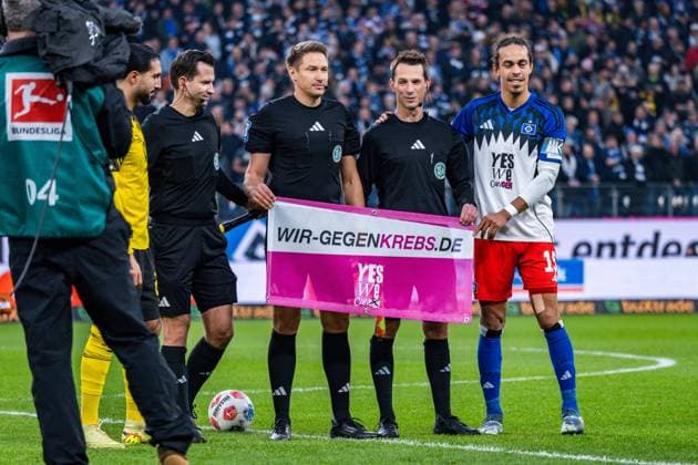 08 11 2025, Hamburger SV vs Borussia Dortmund, 1 Bundesliga, 10 Matchday We against cancer Banner campaign Emre Can Borussia Dortmund, 23 Yussuf Poulsen Hamburger SV, 15 Important note According to the regulations of the DFL German Football League and the DFB German Football Association, it is prohibited to use photographs taken in the stadium and or of the match in the form of sequential images and or video-like photo series Copyright: xBahhoxKarax