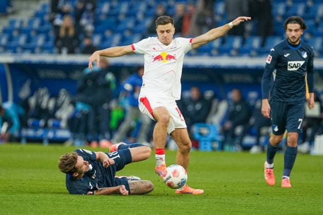 Soccer Bundesliga, Matchday 10, TSG Hoffenheim RB Leipzig on 08 11 2025 in Sinsheim PreZero Arena , Germany, Season 2025 2026 DFL REGULATIONS PROHIBIT ANY USE OF PHOTOGRAPHS AS IMAGE SEQUENCES AND OR QUASI VIDEO Christoph Baumgartner 14, RBL in duel with Wouter Burger 18, TSG Sinsheim PreZero Arena Germany Copyright: xChristophxKinzingerx
