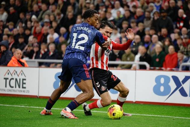 8th November 2025; Stadium of Light, Sunderland, England; Premier League Football, Sunderland versus Arsenal; Jurrien Timber of Arsenal challenges with Enzo Le Fee of Sunderland  CraigxCowan