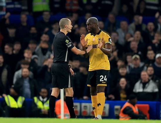 Toti Gomes of Wolverhampton Wanderers confronts referee Andrew Kitchen Chelsea v Wolverhampton Wanderers, Premier League, Football, Stamford Bridge, London, UK - 08 Nov 2025London Stamford Bridge United Kingdom EDITORIAL USE ONLY No use with unauthorised audio, video, data, fixture lists, club league logos or live services. Online in-match use limited to 120 images, no video emulation. No use in betting, games or single club league player publications. Copyright: xGeorgexTewkesbury Shutterstockx 15702174ag