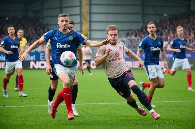 09 11 2025, Soccer, Men, 2 BL Bundesliga , Season 2025 2026, Holstein Kiel Fortuna Düsseldorf, Matchday 12 Carl Johansson in duel Christian Rasmussen Kiel Holstein Stadion Schleswig Holstein Germany