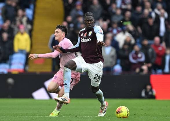 Birmingham, England, 9th November 2025. Amadou Onana of Aston Villa and Alex Jimenez of Bournemouth battle for the ball during the Aston Villa vs AFC Bournemouth Premier League match at Villa Park, Birmingham. Picture credit should read: Cody Froggatt Sportimage EDITORIAL USE ONLY. No use with unauthorised audio, video, data, fixture lists, club league logos or live services. Online in-match use limited to 120 images, no video emulation. No use in betting, games or single club league player publications. SPI_031_CF_ASTON_VILLA_V_BOURNEMOUTH SPI-4279-0031