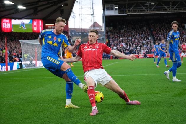 Sean Longstaff of Leeds United challenges for the ball against Elliot Anderson of Nottingham Forest during the Premier league football match between Nottingham Forest and Leeds United at City Ground in Nottingham. Copyright: xPaulxBonser SportsxPressxPhotox Sportspressphoto_SPR59598