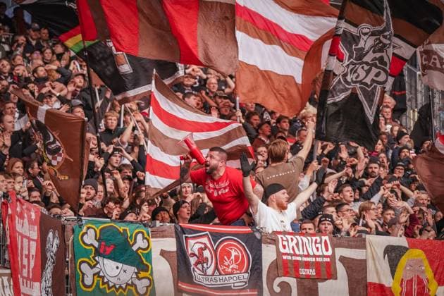 Germany, Freiburg, Europe, Soccer Bundesliga 2025 26, 10 Matchday SC Freiburg vs FC St Pauli, Europa Park Stadium, guest block, Ultras Sankt Pauli, fan block, atmosphere, sea of flags, megaphone, support, emotion, fan culture, passion, away fans, curve, team spirit, choreography, stadium Freiburg im Breisgau Baden Württemberg Germany Copyright: xJOERANxSTEINSIEKx