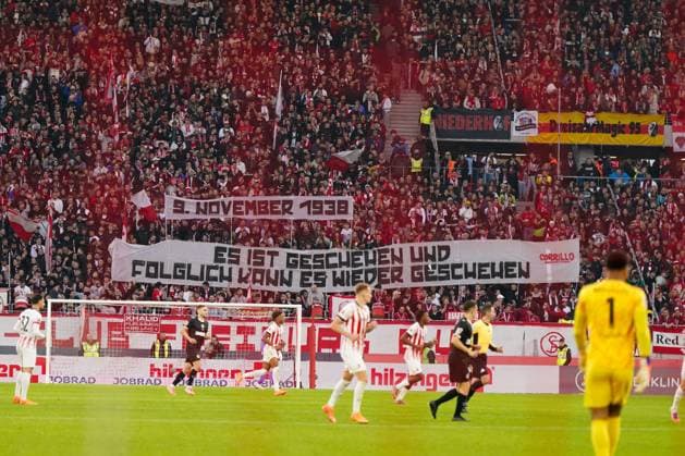 Germany, Freiburg, Europe, Bundesliga 2025 26, Matchday 10 SC Freiburg vs FC St Pauli, Europa Park Stadion, home curve, commemorative banner, 9 November 1938, culture of remembrance, anti-Semitism reminder, democracy, responsibility, history, fan culture, solidarity, stadium, Bundesliga Freiburg im Breisgau Baden Württemberg Germany Copyright: xJOERANxSTEINSIEKx