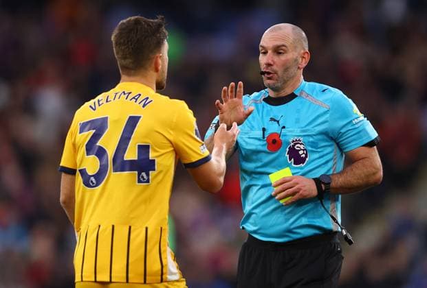 London, England, 9th November 2025. Joel Veltman of Brighton and Hove Albion talks to referee Tim Robinson after being shown a yellow card during the Crystal Palace vs Brighton and Hove Albion Premier League match at Selhurst Park, London. Picture credit should read: Paul Terry Sportimage EDITORIAL USE ONLY. No use with unauthorised audio, video, data, fixture lists, club league logos or live services. Online in-match use limited to 120 images, no video emulation. No use in betting, games or single club league player publications. SPI_023_PT_Crystal_Palace_Brighton SPI-4277-0023
