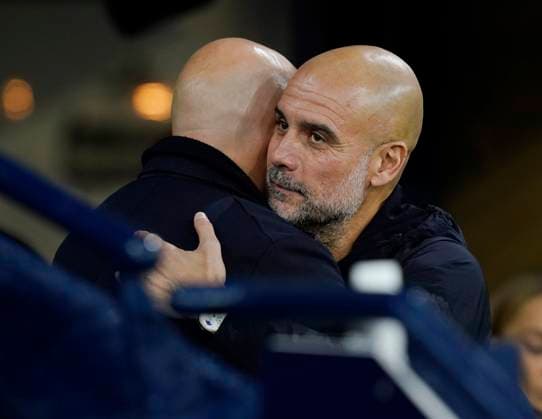 Manchester, England, 9th November 2025. Pep Guardiola coach of Manchester City (r) greets Arne Slot manager of Liverpool during the Manchester City vs Liverpool Premier League match at the Etihad Stadium, Manchester. Picture credit should read: Andrew Yates Sportimage EDITORIAL USE ONLY. No use with unauthorised audio, video, data, fixture lists, club league logos or live services. Online in-match use limited to 120 images, no video emulation. No use in betting, games or single club league player publications. SPI_020_AY_Man_City_Liverpool SPI-4280-0021