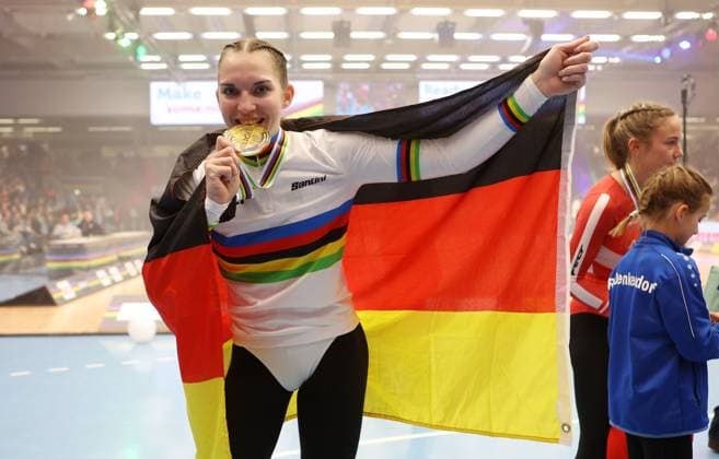 BAU 09 11 2025 Göppingen Artistic Cycling UCI Indoor Cycling World Championships 2025, World Champion Jana Pfann GER cheers and bites into her medal