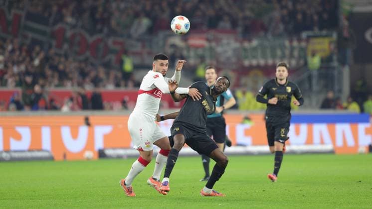 Stuttgart , Bundesliga Football VfB Stuttgart vs FC Augsburg , v l Deniz Undav VfB Chrislain Matsima Augsburg In accordance with the regulations of the DFL German Football League, it is prohibited to use or have used photographs taken in the stadium and or of the match in the form of sequential images and or video-like photo series