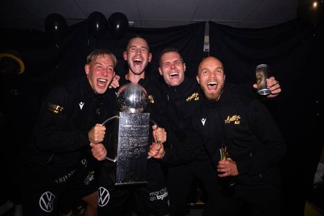 251109 Mjällbys players cheer with Lennart Johanssons trophy after the football match in Allsvenskan between Mjällby and Häcken on November 9, 2025 in Hällevik  Copyright: MATHILDAxSCHULER BB251109MA077