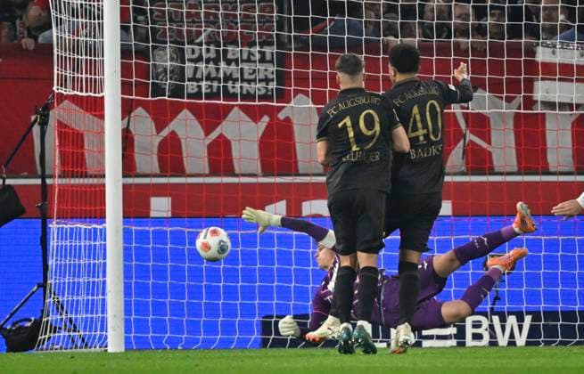 GOAL for 2 2 Deniz Undav VfB Stuttgart 26 against goalkeeper Finn Dahmen FC Augsburg FCA 01 VfB Stuttgart vs FC Augsburg FCA 09 11 2025 DFL REGULATIONS PROHIBIT ANY USE OF PHOTOGRAPHS AS IMAGE SEQUENCES AND OR QUASI VIDEO VfB Stuttgart vs FC Augsburg FCA