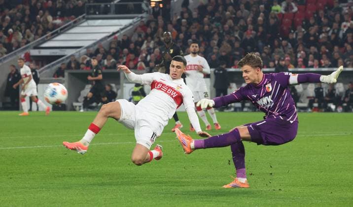 Stuttgart , Bundesliga soccer VfB Stuttgart vs FC Augsburg , from left Bilal El Khannouss VfB Finn Dahmen Augs According to the regulations of the DFL German Soccer League, it is prohibited to use or have used photographs taken in the stadium and or of the match in the form of sequential images and or video-like photo series