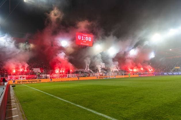 09 11 2025, Football, GER, Season, 3 Liga, Season 2025 2026, Matchday 14, SSV Jahn Regensburg TSV 1860 Munich Pyrotechnics by Regensburg fans on the Hans Jakob Tibüne DFL REGULATIONS PROHIBIT ANY USE OF PHOTOGRAPHS AS IMAGE SEQUENCES AND OR QUASI VIDEO