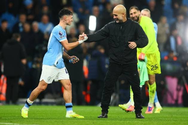 Manchester City manager Pep Guardiola with Phil Foden at the end of the match Manchester City v Liverpool, Premier League, Football, Etihad Stadium, Manchester, UK - 09 Nov 2025Manchester Etihad Stadium United Kingdom EDITORIAL USE ONLY No use with unauthorised audio, video, data, fixture lists, club league logos or live services. Online in-match use limited to 120 images, no video emulation. No use in betting, games or single club league player publications.  Copyright: xPaulxCurrie Shutterstockx 15702266ed