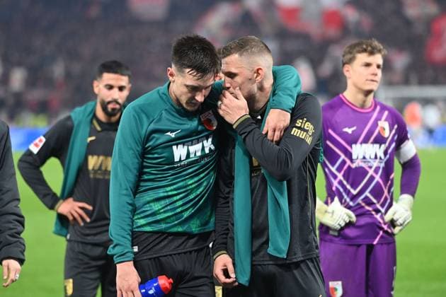 Keven SCHLOTTERBECK FC Augsburg , Jeffrey GOUWELEEUW Augsburg after the end of the game in front of the Augsburg fan block, disappointment,frustration,disappointed,frustrated,dejected, Football 1 Bundesliga Season 2025 2026, 10 Matchday, Matchday10 VfB Stuttgart FC Augsburg 3 2 on 09 11 2025 MHP ARENA