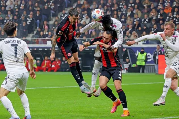 Frankfurt, Germany 09 November 2025 1 BL 2025 2026 Eintracht Frankfurt vs FSV Mainz 05 In the picture from left fighting for the ball Robin Koch Frankfurt , Danny da Costa Mainz , Arthur Theate Frankfurt and Lennard Maloney Mainz DFL regulations prohibit any use of photographs as image sequences and or quasi video Deutsche Bank Park Hessen Copyright: xFotostandx xRacochax