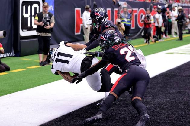 November 9, 2025, Houston, Texas, U.S: Jacksonville Jaguars wide receiver Parker Washington (11) catches a pass in the end zone for a touchdown during the first quarter of the NFL, American Football Herren, USA game between the Houston Texans and the Jacksonville Jaguars at NRG Stadium in Houston, TX on November 9, 2025. Houston U.S - ZUMAw137 20251109_aap_w137_031 Copyright: xErikxWilliamsx