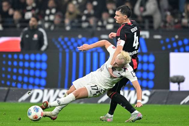 Soccer 1 Bundesliga 10 Matchday Eintracht Frankfurt 1 FSV Mainz 05 on 09 11 2025 at Deutsche Bank Park in Frankfurt Benedict Hollerbach Mainz , left Robin Koch Frankfurt , right DFL regulations prohibit any use of photographs as image sequences and or quasi video xJKx