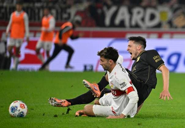 Atakan Karazor VfB Stuttgart 16 vs Dimitrios Giannoulis FC Augsburg FCA 13 VfB Stuttgart vs FC Augsburg FCA 09 11 2025 DFL REGULATIONS PROHIBIT ANY USE OF PHOTOGRAPHS AS IMAGE SEQUENCES AND OR QUASI VIDEO VfB Stuttgart vs FC Augsburg FCA