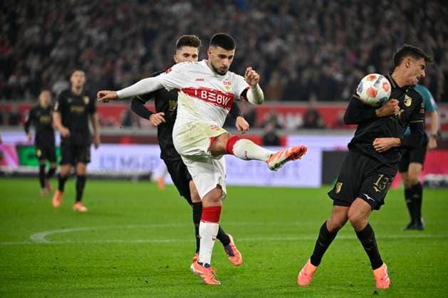 Deniz Undav VfB Stuttgart 26 Action on the ball Goal shot Action Goal chance hits Dimitrios Giannoulis FC Augsburg FCA 13 VfB Stuttgart vs FC Augsburg FCA 09 11 2025 DFL REGULATIONS PROHIBIT ANY USE OF PHOTOGRAPHS AS IMAGE SEQUENCES AND OR QUASI VIDEO VfB Stuttgart vs FC Augsburg FCA