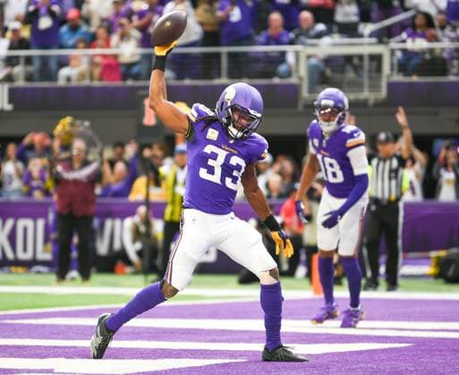 Minnesota Vikings running back Aaron Jones Sr. celebrates after scoring a touchdown against Baltimore Ravens in the first quarter against the Minnesota Vikings at U.S. Bank Stadium in Minneapolis, Minnesota on Sunday, November 9, 2025.  MIN20251109105 CRAIGxLASSIG