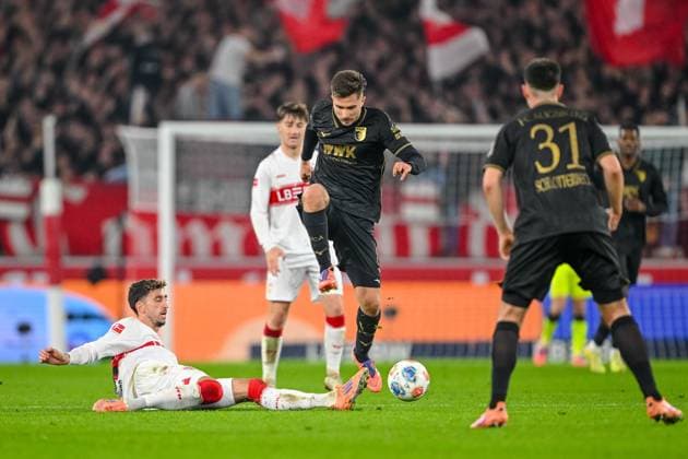 Atakan Karazor (VfB Stuttgart) und Elvis Rexhbecaj (FC Augsburg) im Zweikampf waehrend des spiels der Bundesliga zwischen VfB Stuttgart und FC Augsburg, MHPArena Stuttgart am 09. November 2025 in Stuttgart, Deutschland. (Foto von Harry Langer DeFodi Images) +++ Atakan Karazor (VfB Stuttgart) und Elvis Rexhbecaj (FC Augsburg) battle for the ball during the Bundesliga match between VfB Stuttgart and FC Augsburg at MHPArena Stuttgart on November 9, 2025 in Stuttgart, Germany. (Photo by Harry Langer DeFodi Images) DFL regulations prohibit any use of photographs as image sequences and or quasi-video. (Photo by Harry Langer DeFodi Images) DFL regulations prohibit any use of photographs as image sequences and or quasi-video. Atakan Karazor VfB Stuttgart and Elvis Rexhbecaj FC Augsburg in a duel during the Bundesliga match between VfB Stuttgart and FC Augsburg, MHPArena Stuttgart on November 09, 2025 in Stuttgart, Germany Photo by Harry Langer DeFodi Images Atakan Karazor VfB Stuttgart and Elvis Rexhbecaj FC Augsburg battle for the ball during the Bundesliga match between VfB Stuttgart and FC Augsburg at MHPArena Stuttgart on November 9, 2025 in Stuttgart, Germany Photo by Harry Langer DeFodi Images DFL regulations prohibit any use of photographs as image sequences and or quasi video Photo by Harry Langer DeFodi Images DFL regulations prohibit any use of photographs as image sequences and or quasi video