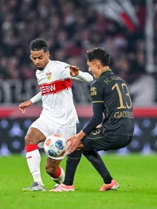 Lorenz Assignon (VfB Stuttgart) und Dimitris Giannoulis (FC Augsburg) im Zweikampf waehrend des spiels der Bundesliga zwischen VfB Stuttgart und FC Augsburg, MHPArena Stuttgart am 09. November 2025 in Stuttgart, Deutschland. (Foto von Harry Langer DeFodi Images) +++ Lorenz Assignon (VfB Stuttgart) und Dimitris Giannoulis (FC Augsburg) battle for the ball during the Bundesliga match between VfB Stuttgart and FC Augsburg at MHPArena Stuttgart on November 9, 2025 in Stuttgart, Germany. (Photo by Harry Langer DeFodi Images) DFL regulations prohibit any use of photographs as image sequences and or quasi-video. (Photo by Harry Langer DeFodi Images) DFL regulations prohibit any use of photographs as image sequences and or quasi-video. Lorenz Assignon VfB Stuttgart and Dimitris Giannoulis FC Augsburg in a duel during the Bundesliga match between VfB Stuttgart and FC Augsburg, MHPArena Stuttgart on November 09, 2025 in Stuttgart, Germany Photo by Harry Langer DeFodi Images Lorenz Assignon VfB Stuttgart and Dimitris Giannoulis FC Augsburg battle for the ball during the Bundesliga match between VfB Stuttgart and FC Augsburg at MHPArena Stuttgart on November 9, 2025 in Stuttgart, Germany Photo by Harry Langer DeFodi Images DFL regulations prohibit any use of photographs as image sequences and or quasi video Photo by Harry Langer DeFodi Images DFL regulations prohibit any use of photographs as image sequences and or quasi video