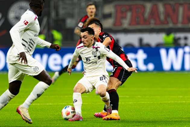 Bundesliga Eintracht Frankfurt v FSV Mainz Paul Nebel of 1.FSV Mainz 05 battle for the ball against Arthur Theate of Eintracht Frankfurt during the Bundesliga Matchday 10 game between Eintracht Frankfurt and 1. FSV Mainz 05 at Deutsche Bank Park in Frankfurt, Germany. (Photo by Kadir Caliskan Middle East Images) Frankfurt Hesse Germany Copyright: xKadirxCaliskanx