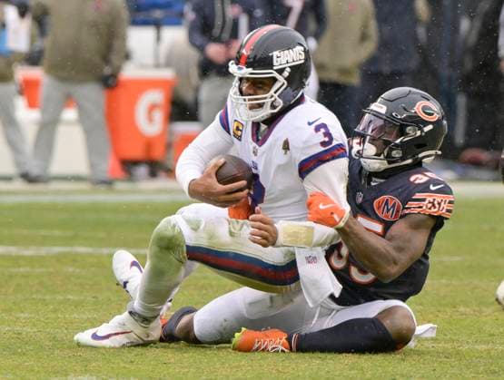 Chicago Bears safety C.J. Gardner-Johnson (35) sacks New York Giants quarterback Russell Wilson (3) during the fourth quarter at Soldier Field in Chicago on Sunday, November 9, 2025. The Bears defeated the Giants 24-20.  CHI20251109124 MARKxBLACK