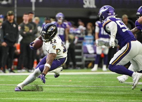 Baltimore Ravens running back Derrick Henry (L) runs past Minnesota Vikings linebacker Eric Wilson (R) in the fourth quarter at U.S. Bank Stadium in Minneapolis, Minnesota on Sunday, November 9, 2025.  MIN20251109117 CRAIGxLASSIG
