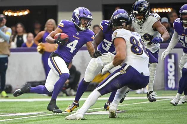 Minnesota Vikings wide receiver Myles Price (L) runs past Baltimore Ravens defenders in the first quarter at U.S. Bank Stadium in Minneapolis, Minnesota on Sunday, November 9, 2025.  MIN20251109128 CRAIGxLASSIG