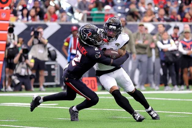 November 9, 2025, Houston, Texas, U.S: Jacksonville Jaguars wide receiver Parker Washington (11) is tackled by Houston Texans safety Calen Bullock (2) after a catch during the third quarter of the NFL, American Football Herren, USA game between the Houston Texans and the Jacksonville Jaguars at NRG Stadium in Houston, TX on November 9, 2025. Houston won, 36-29. Houston U.S - ZUMAw137 20251109_aap_w137_063 Copyright: xErikxWilliamsx