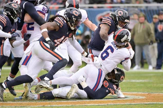 New York Giants quarterback Jaxson Dart (6) is tackled during the first half against the Chicago Bears at Soldier Field in Chicago on Sunday, November 9, 2025.  CHI20251109140 MARKxBLACK
