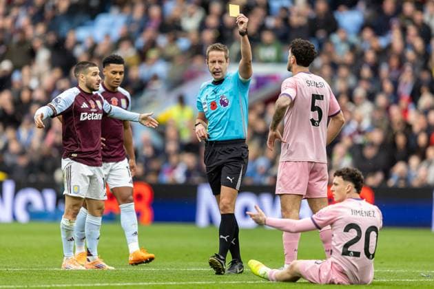Aston Villa v Bournemouth Premier League 09 11 2025. Bournemouth defender Marcos Senesi (5) booked by referee John Brooks during the Premier League match between Aston Villa and Bournemouth at Villa Park, Birmingham, England on 9 November 2025. Editorial use only DataCo restrictions apply See www.football-dataco.com , Copyright: xManjitxNarotrax PSI-23205-0066