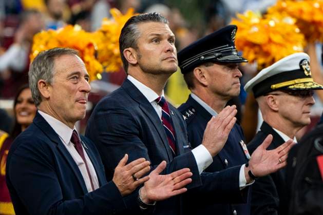 Secretary of Defense Pete Hegseth and Washington Commanders owner Josh Harris look on before a game against the Washington Commanders and the Detroit Lions at Northwest Stadium in Landover, Maryland on Sunday, November 9, 2025. The Lions beat the Commanders 44-22.  WAP20251109304 BONNIExCASH