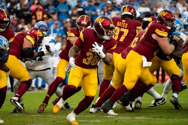 Washington Commanders running back Chris Rodriguez Jr. (36) runs the ball on first down in the first quarter of a game against the Detroit Lions at Northwest Stadium in Landover, Maryland on Sunday, November 9, 2025. The Lions beat the Commanders 44-22.  WAP20251109307 BONNIExCASH