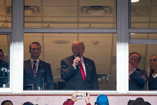 President Donald Trump swears in new members of the military during the half-time of a game against the Washington Commanders and the Detroit Lions at Northwest Stadium in Landover, Maryland on Sunday, November 9, 2025. The Lions beat the Commanders 44-22.  WAP20251109358 BONNIExCASH