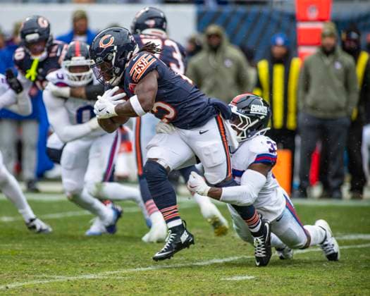 November 9, 2025: Chicago Bears Kyle Monangai (25) is tackled by New York Giants Demetrius Flannigan-Fowles (33) during the game in Chicago, IL. CSM Chicago United States of America - ZUMAc04_ 20251109_zma_c04_215 Copyright: xMikexWulfx
