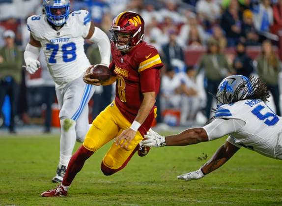 Nov 9, 2025: Washington Commanders QB 8 Marcus Mariota slips out of the reach of Detroit Lions DL LD 54 Alim McNeill during the Washington Commanders game against the Detroit Lions at Northwest Stadium in Landover, MD. CSM Landover United States of America - ZUMAc04_ 20251109_zma_c04_249 Copyright: xJustinxCooperx