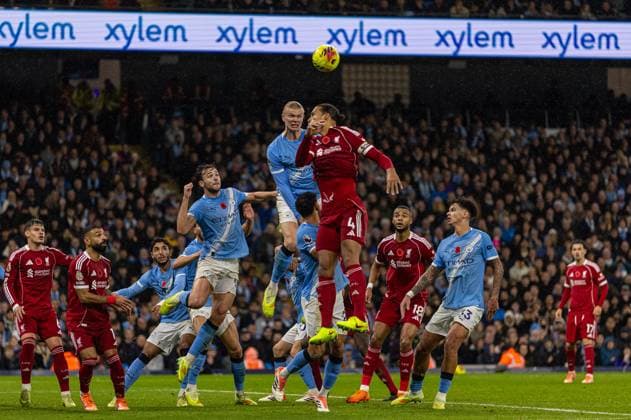 (251110) -- MANCHESTER, Nov. 10, 2025 -- Manchester City s Erling Haaland (top, L) challenges for a header with Liverpool s captain Virgil van Dijk during the English Premier League match between Manchester City FC and Liverpool FC in Manchester, Britain, on Nov. 9, 2025. FOR EDITORIAL USE ONLY. NOT FOR SALE FOR MARKETING OR ADVERTISING CAMPAIGNS. NO USE WITH UNAUTHORIZED AUDIO, VIDEO, DATA, FIXTURE LISTS, CLUB LEAGUE LOGOS OR LIVE SERVICES. ONLINE IN-MATCH USE LIMITED TO 45 IMAGES, NO VIDEO EMULATION. NO USE IN BETTING, GAMES OR SINGLE CLUB LEAGUE PLAYER PUBLICATIONS. (SP)BRITAIN-MANCHESTER-FOOTBALL-PREMIER LEAGUE-MANCHESTER CITY VS LIVERPOOL LixYing 