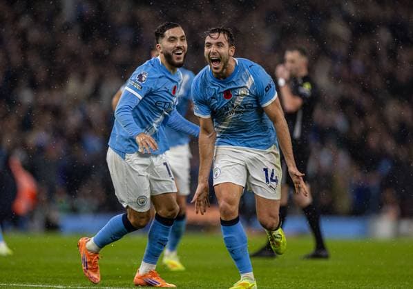 (251110) -- MANCHESTER, Nov. 10, 2025 -- Manchester City s Nico Gonzalez (R) celebrates after scoring during the English Premier League match between Manchester City FC and Liverpool FC in Manchester, Britain, on Nov. 9, 2025. FOR EDITORIAL USE ONLY. NOT FOR SALE FOR MARKETING OR ADVERTISING CAMPAIGNS. NO USE WITH UNAUTHORIZED AUDIO, VIDEO, DATA, FIXTURE LISTS, CLUB LEAGUE LOGOS OR LIVE SERVICES. ONLINE IN-MATCH USE LIMITED TO 45 IMAGES, NO VIDEO EMULATION. NO USE IN BETTING, GAMES OR SINGLE CLUB LEAGUE PLAYER PUBLICATIONS. (SP)BRITAIN-MANCHESTER-FOOTBALL-PREMIER LEAGUE-MANCHESTER CITY VS LIVERPOOL LixYing 