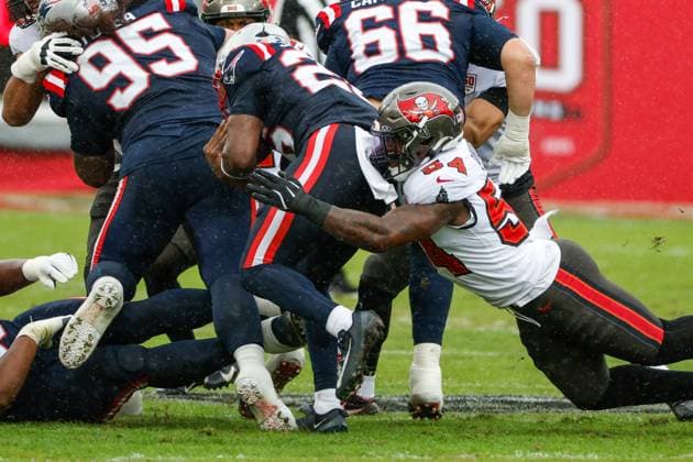 November 9, 2025, Tampa, Florida, USA: Tampa Bay Buccaneers linebacker Lavonte David (54) tackles New England Patriots running back Terrell Jennings (26) during the first quarter at Raymond James Stadium in Tampa on Sunday, Nov. 9, 2025. Tampa USA - ZUMAs70_ 20251109_zan_s70_084 Copyright: xJeffereexWoox