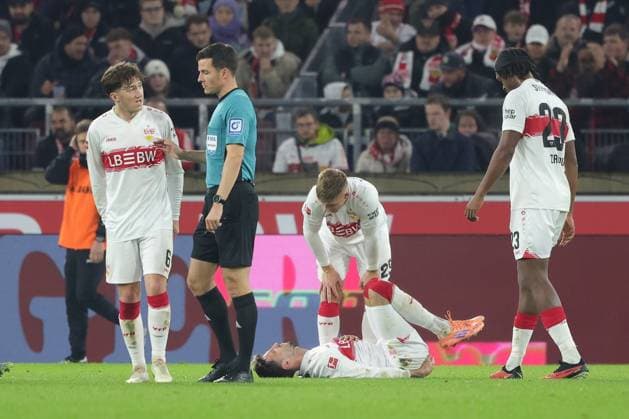 Stuttgart , Bundesliga soccer VfB Stuttgart vs FC Augsburg , Atakan Karazor VfB lies injured on the ground According to the regulations of the DFL German Soccer League, it is prohibited to use or have used photographs taken in the stadium and or of the match in the form of sequential images and or video-like photo series